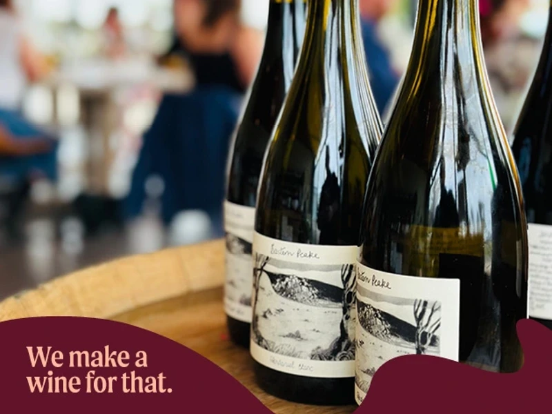 a group of wine bottles on a barrel