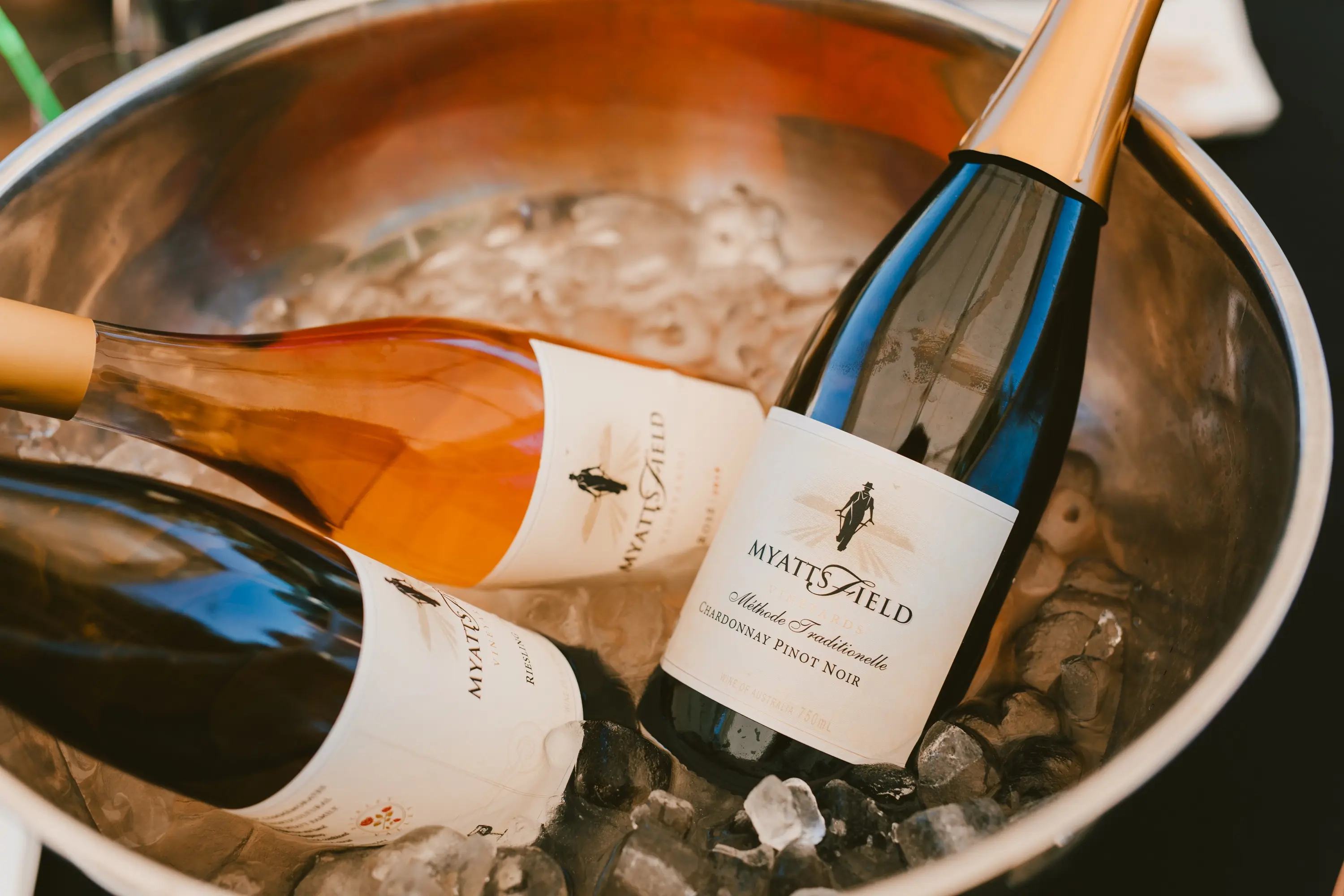 a group of bottles in a bucket of ice
