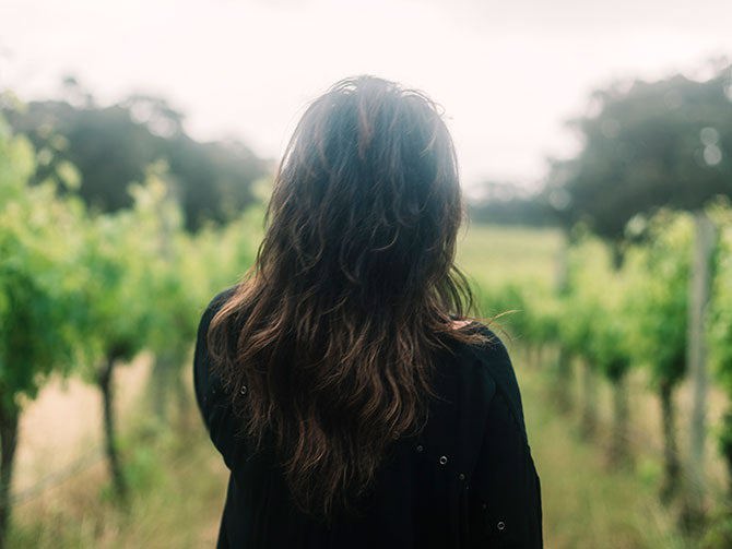 Virginia Willcock in vineyard
